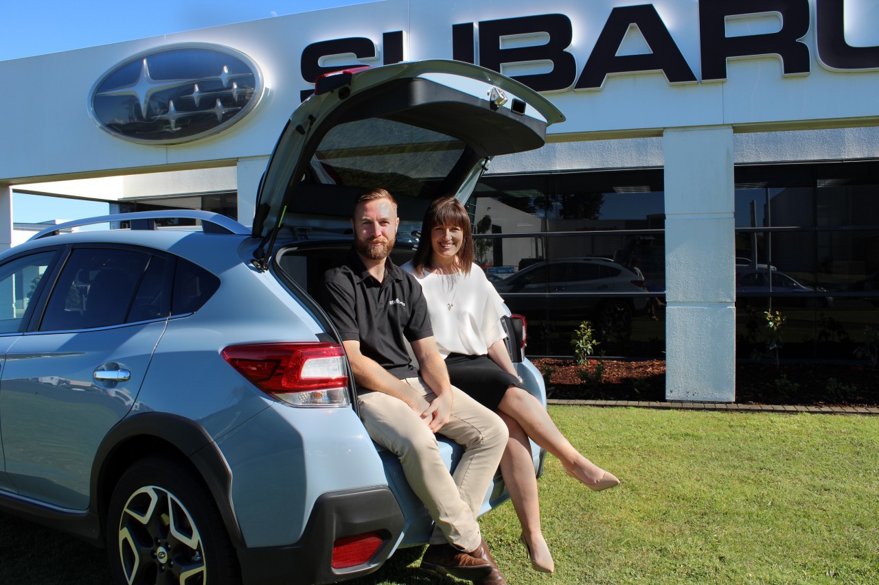 Subaru of New Zealand's Marketing Manager Daile Stephens and Stuff Event Manager Henry McIernon with the Subaru XV.