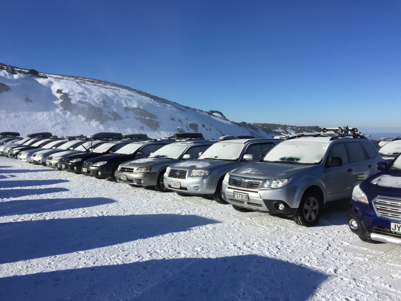 Subaru vehicles at Turoa ski area covered in now. 