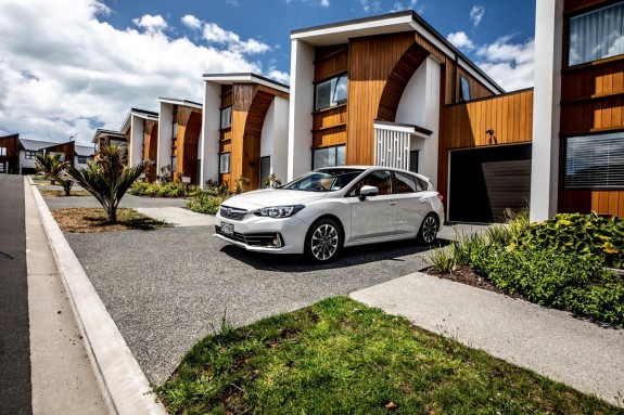 Subaru Impreza outside a row of houses