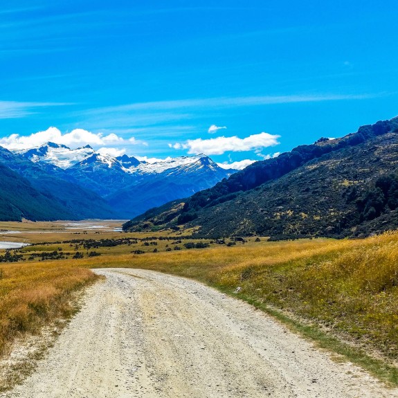 NZ mountain range and gravel road Subaru XV