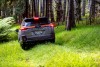 Subaru Outback Rear in River Rock Pearl in forest